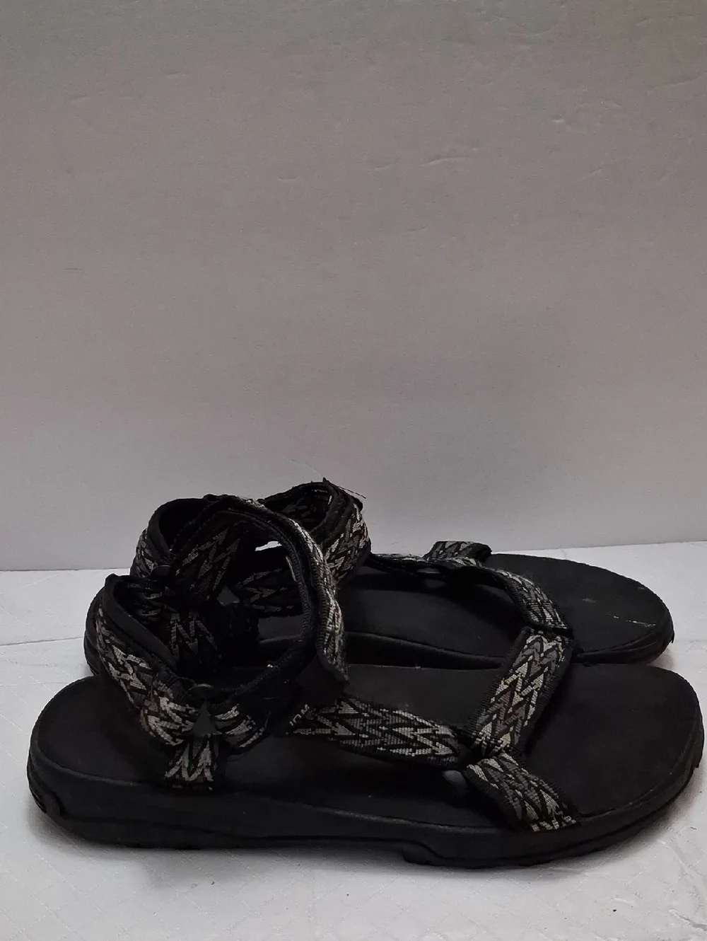 Teva Size 10 men's sandal in black, gray strap with velcro adjustable strap.